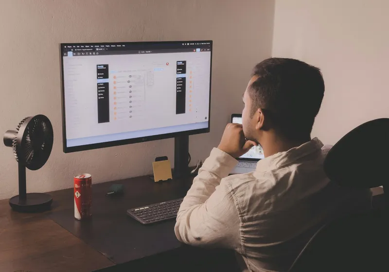Professional reviewing an organized digital file management system on screen