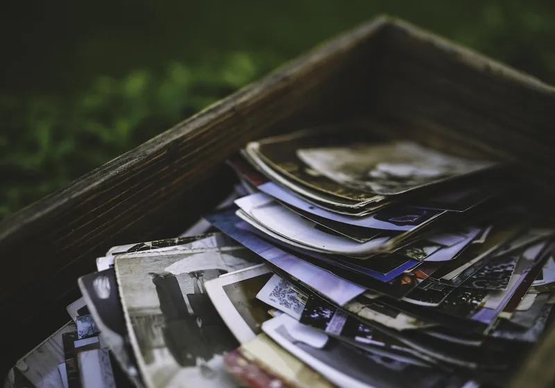 Wooden box filled with old family photos and memories
