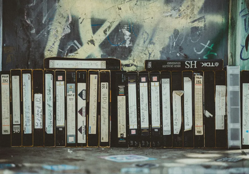 Collection of old VHS tapes deteriorating over time